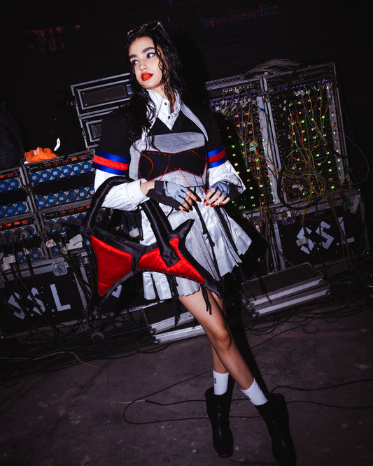 Model backstage at the BUDXNBAHOUSE fashion show wearing White Cropped Shirt
