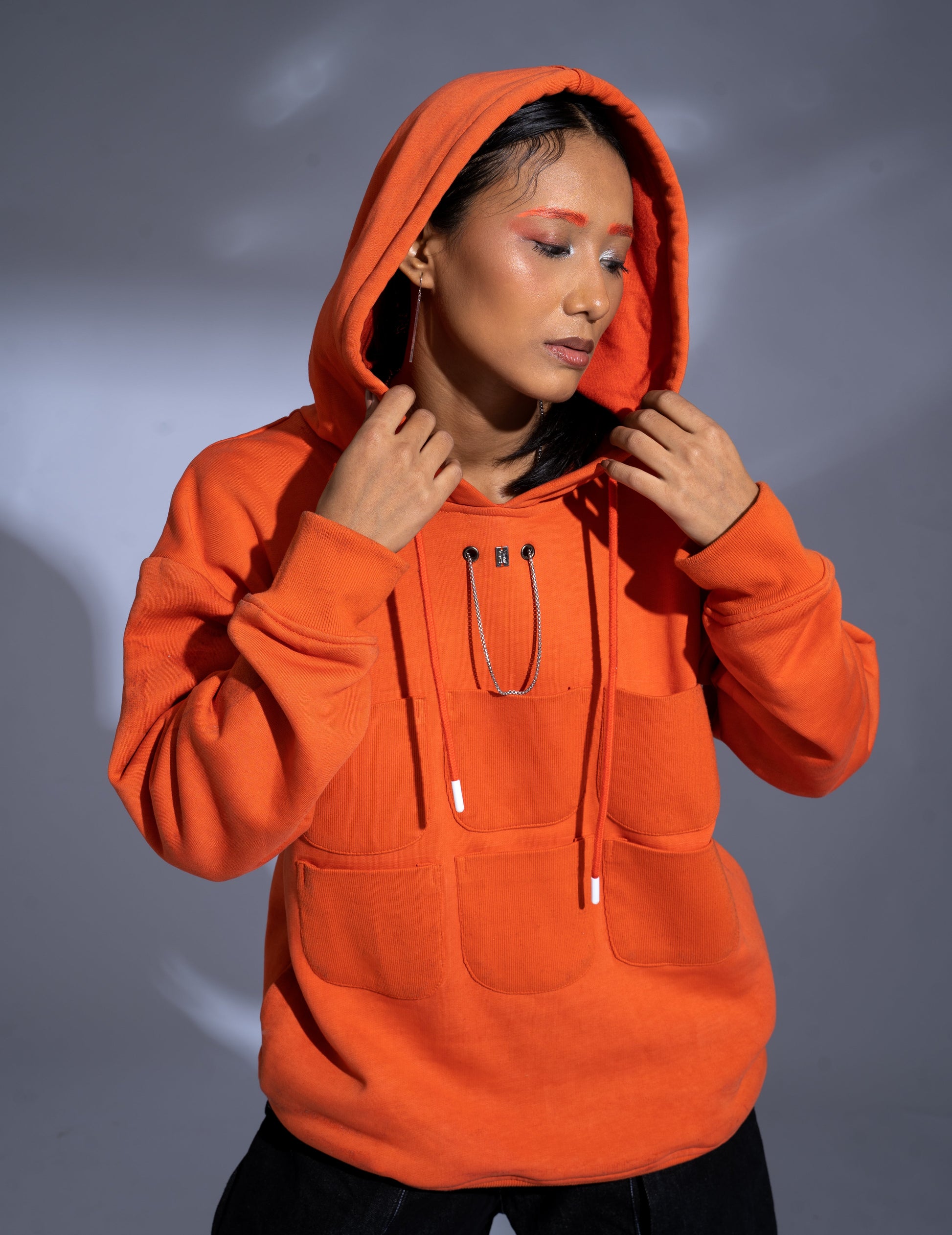 Pocket Hoodie: The model is wearing size S.