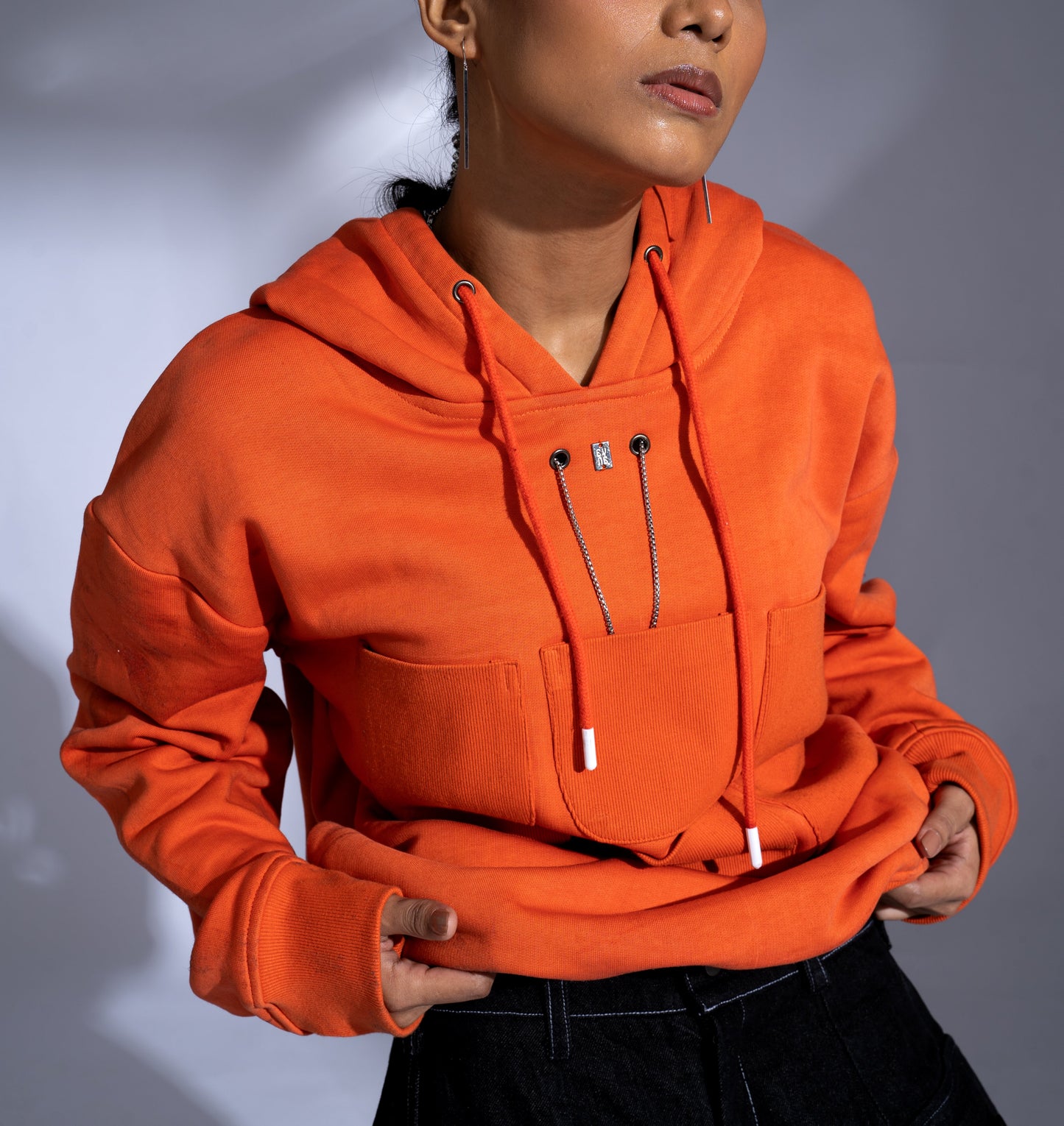 Pocket Hoodie: The model is wearing size S.