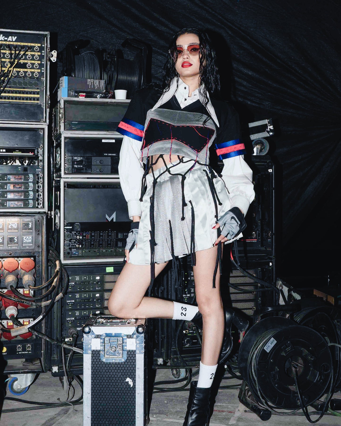 Model backstage at the BUDXNBAHOUSE fashion show wearing White Cropped Shirt