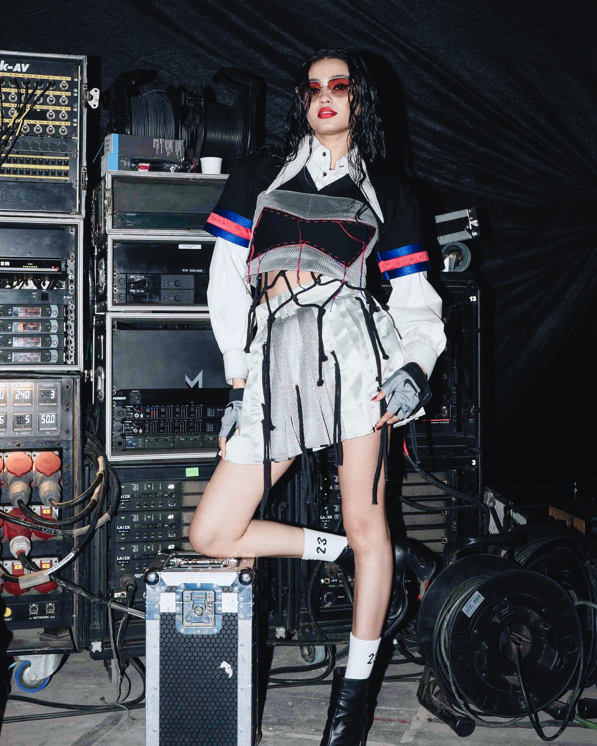 Model backstage at the BUDXNBAHOUSE fashion show wearing White Cropped Shirt