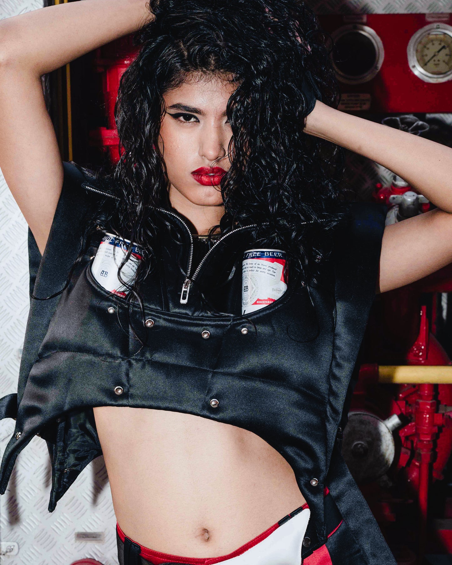 Model walking the runway at the BUDXNBAHOUSE fashion show wearing Black Puffer Jacket Vest.