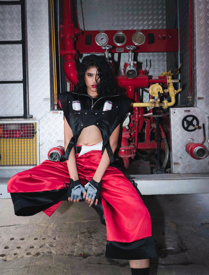 Model backstage at the BUDXNBAHOUSE fashion show wearing Apex Red Black Satin Jorts
