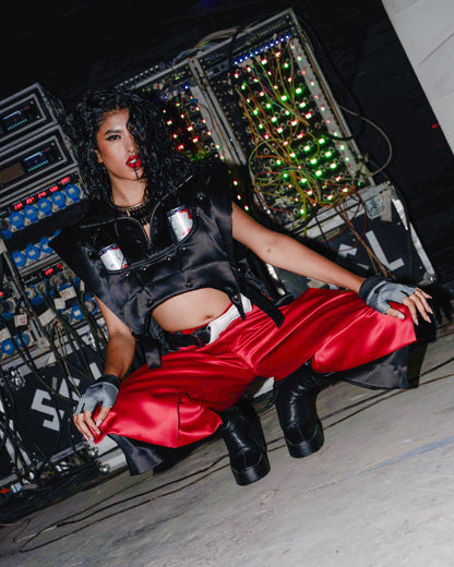 Model backstage at the BUDXNBAHOUSE fashion show wearing Apex Black Satin Puffer Jacket Vest