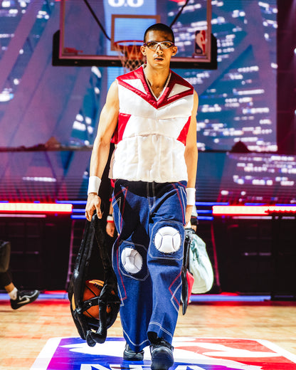 Model walking the ramp at the BUDXNBAHOUSE fashion show wearing Rogue White Puffer Vest