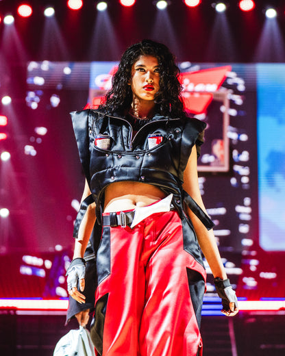 Model walking the runway at the BUDXNBAHOUSE fashion show wearing Black Puffer Vest
