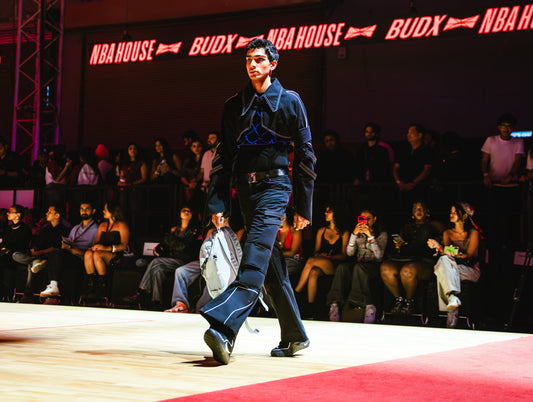 Model walking the runway at the BUDXNBAHOUSE fashion show wearing Jett Cropped Bolero Jacket