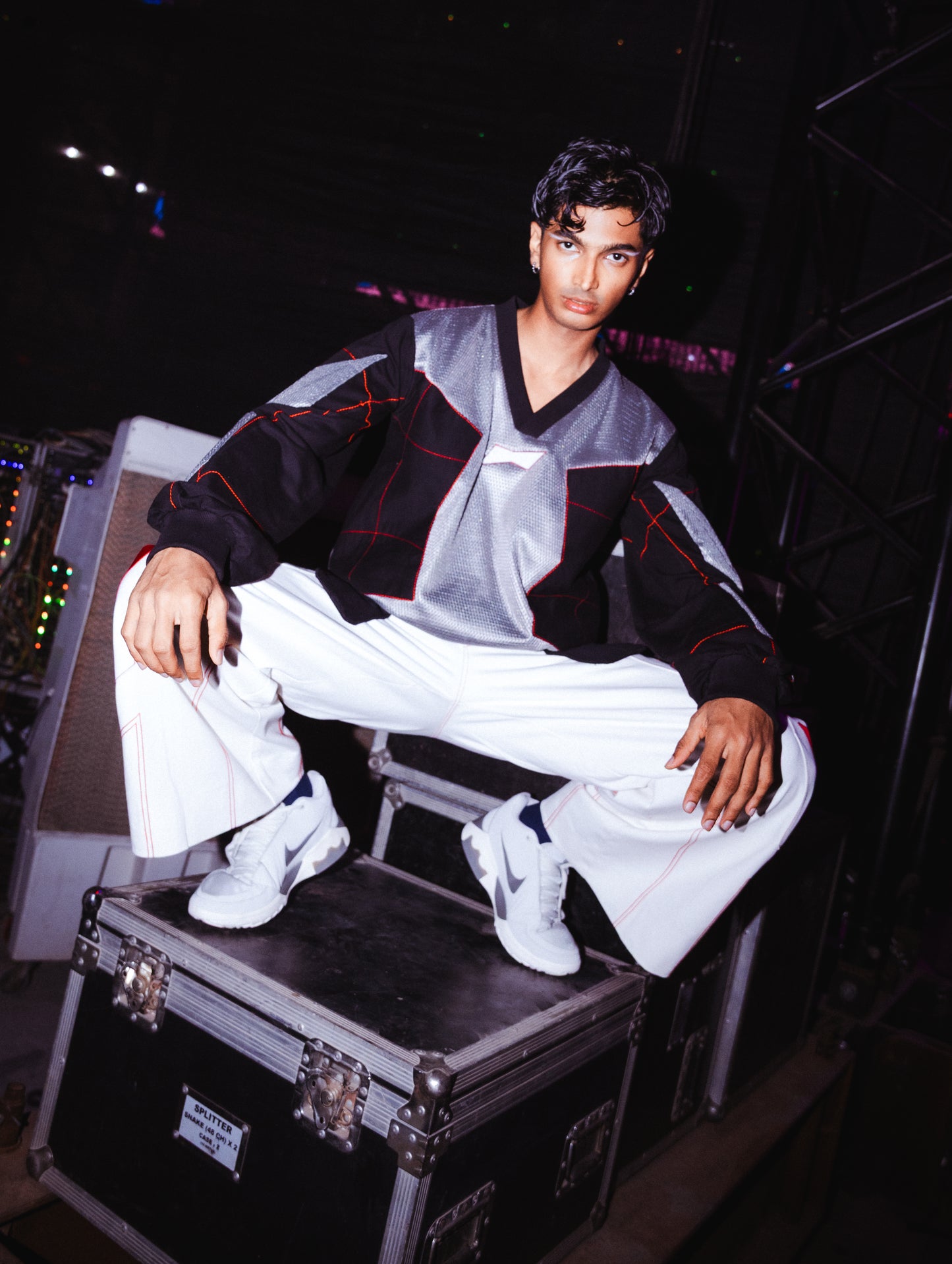 Model backstage at the BUDXNBAHOUSE fashion show wearing Silver Black patchwork T-shirt.
