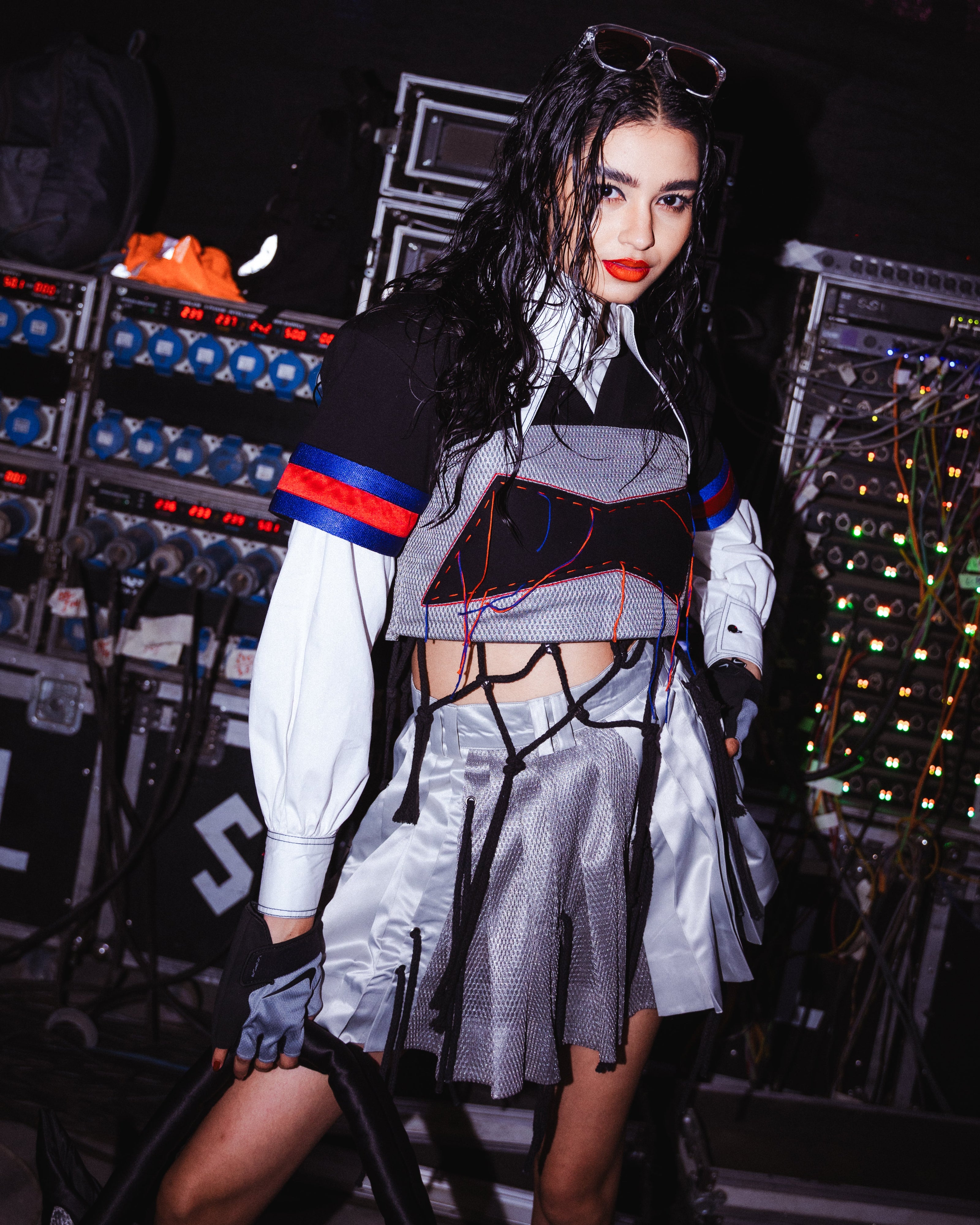 Model backstage at the BUDXNBAHOUSE fashion show wearing Black Silver Crop Top