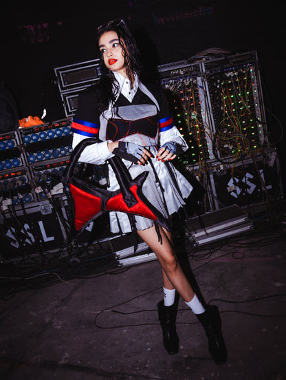 Model backstage at the BUDXNBAHOUSE fashion show wearing Black Silver Crop Top