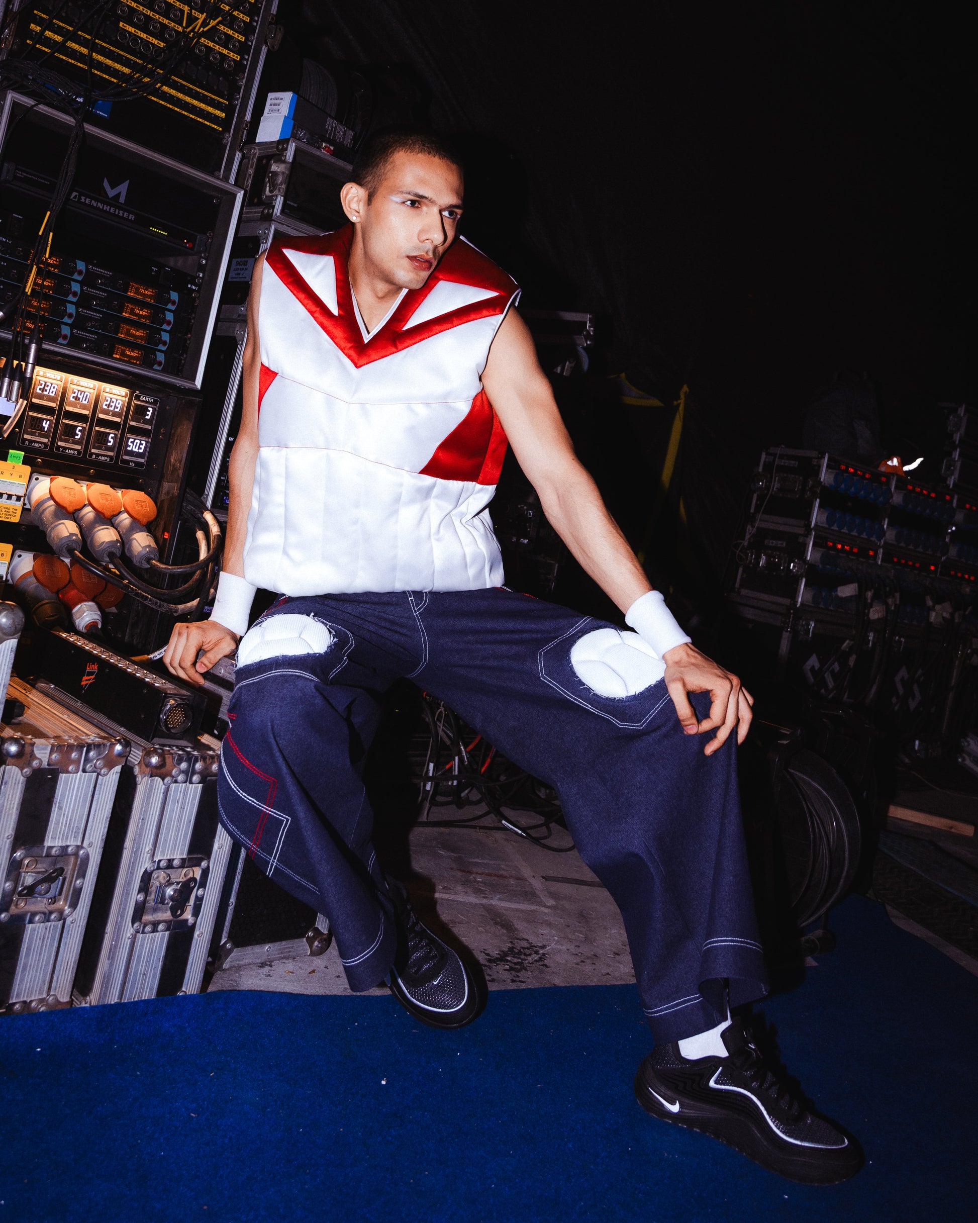 Model backstage at the BUDXNBAHOUSE fashion show wearing Knee Pad Blue Denim Jeans