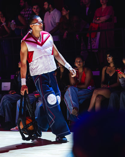 Model walking the ramp at the BUDXNBAHOUSE fashion show wearing Knee Pad Blue Denim Jeans